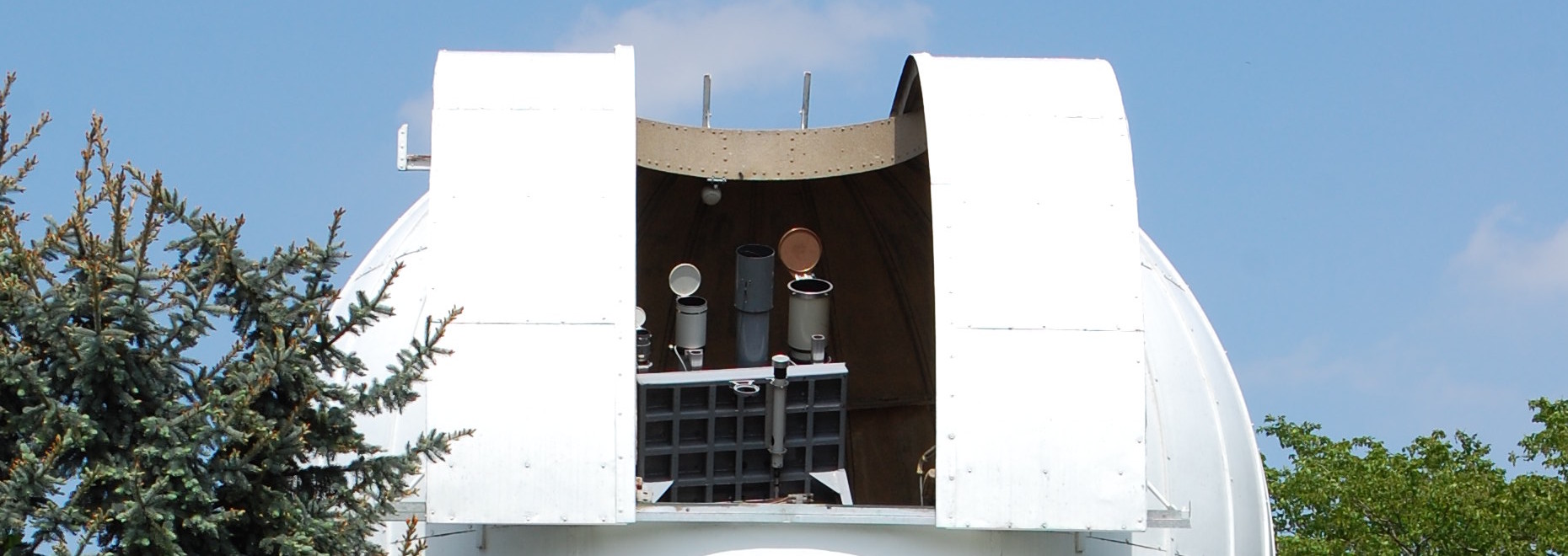 Solar Dome open with Telescopes visible in the sun.